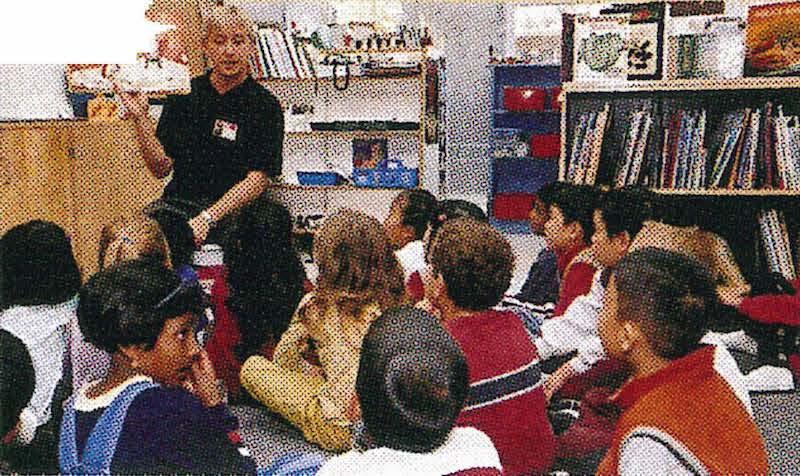 teacher reading to children in classroom