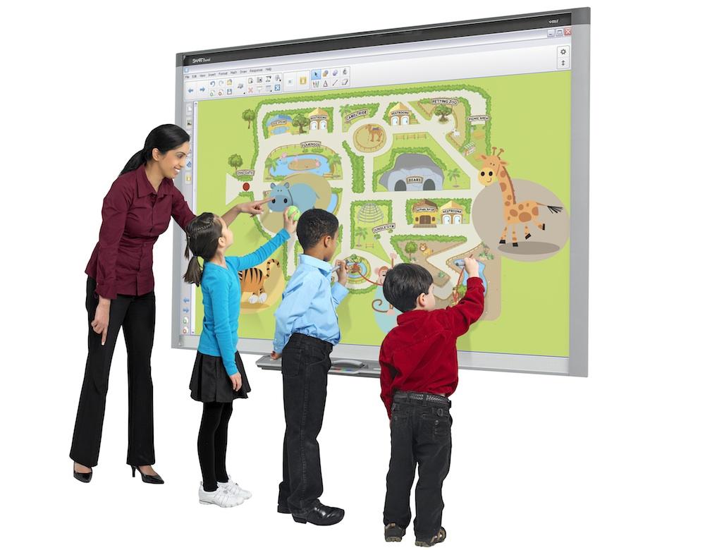image of teacher and elementary students touching a floating browser screen