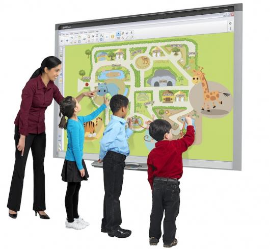 image of teacher and elementary students touching a floating browser screen