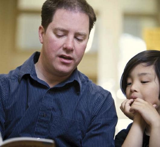 teacher reading to student