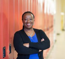 Natasha Henry standing in front of lockers