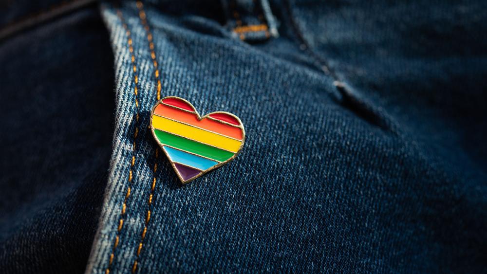 Pride pin on pair of jeans