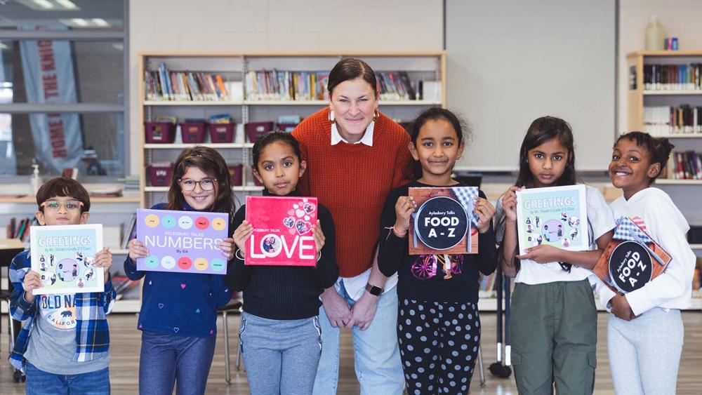 Teacher posing with her students