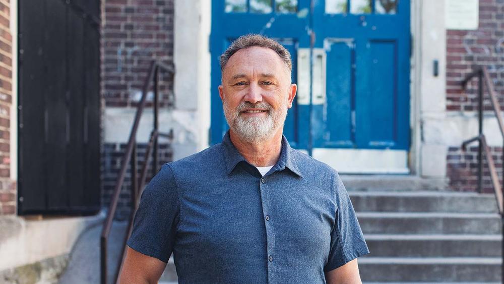 ETFO President David Mastin posing in front of school