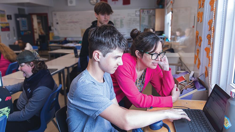 Terri Flemming's students looking at a laptop screen