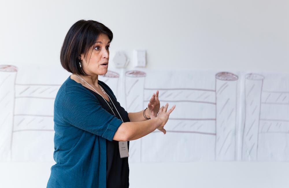 woman presenting at front of class