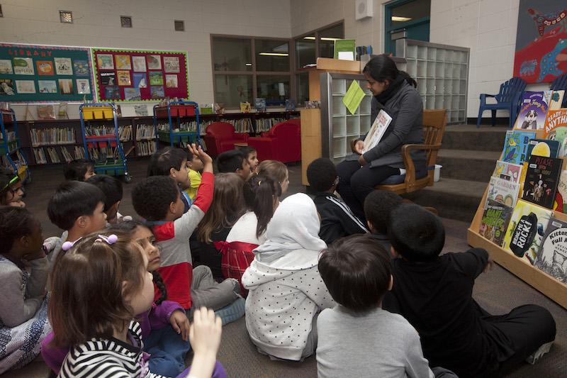 Teacher reading to class. Photo by Kathryn Gaitens