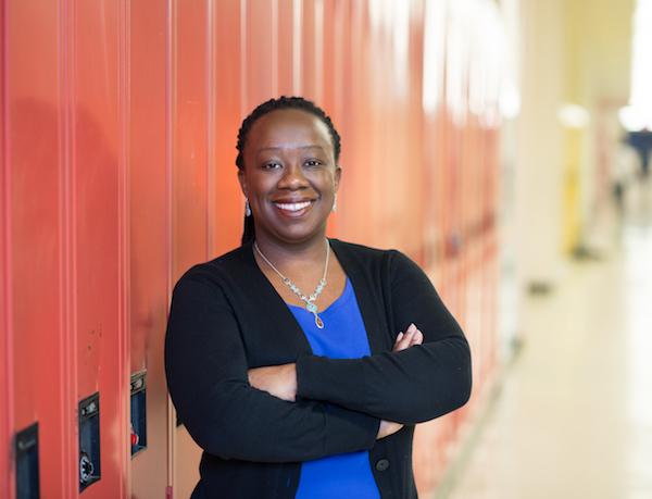 Natasha Henry standing in front of lockers