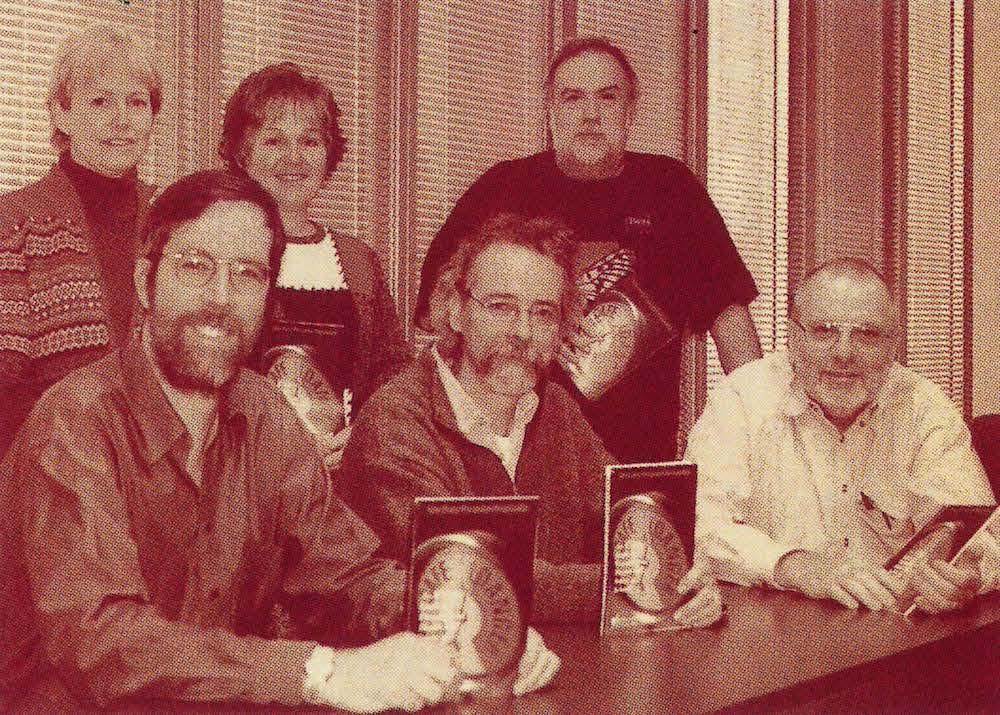 teachers holding the health and safety book