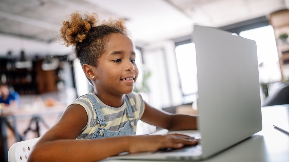 Young girl using laptop