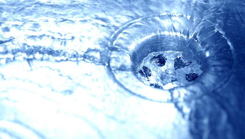 water in sink running down drain