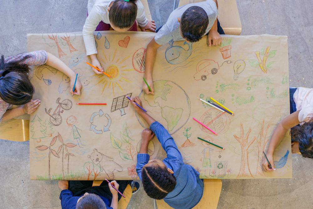 children drawing on paper