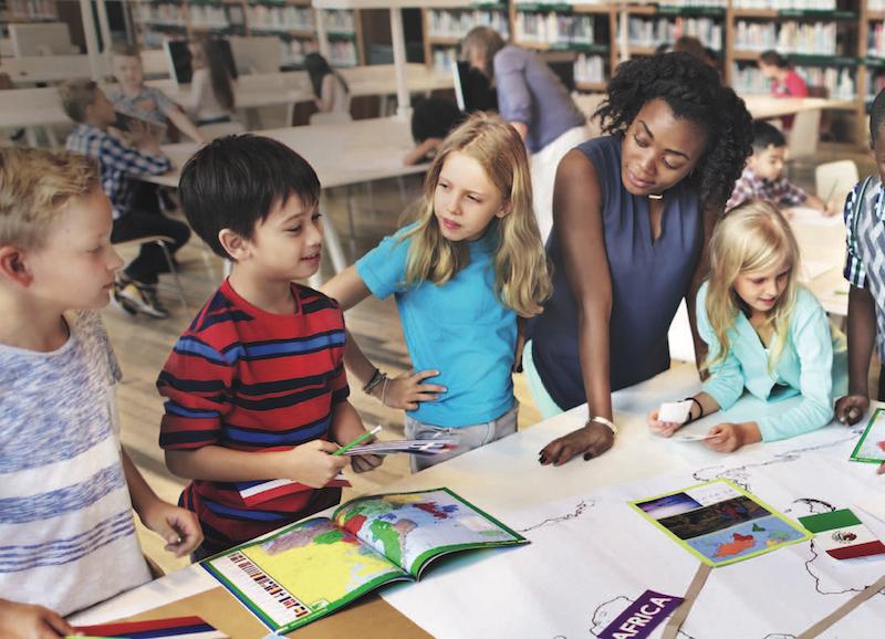 teacher with young children in classroom