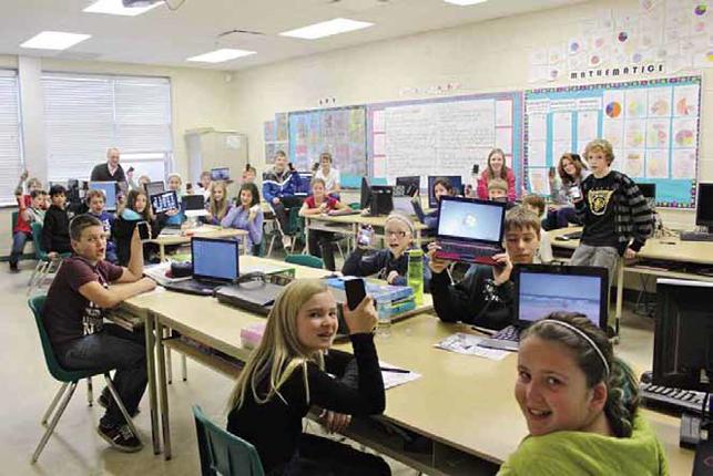 photo of students in classroom working on computers