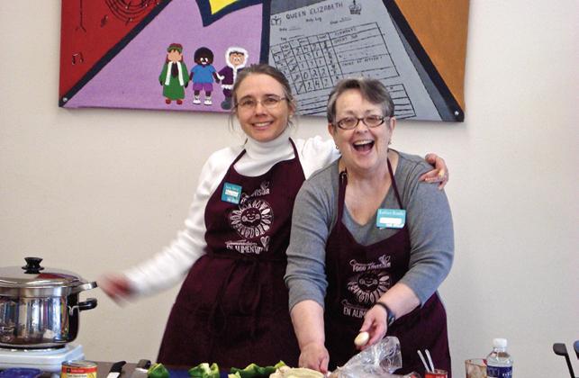 cooking teachers cooking together and smiling