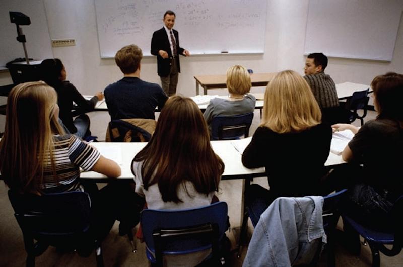 etfo members in classroom listening to man standing at whiteboard