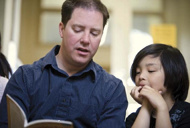 teacher reading to student