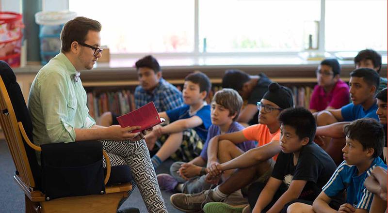 Author reading to students