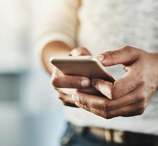 Stock image of person using a cellphone
