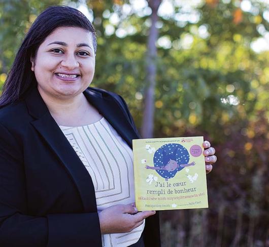 Asha Nagpal posing with book 