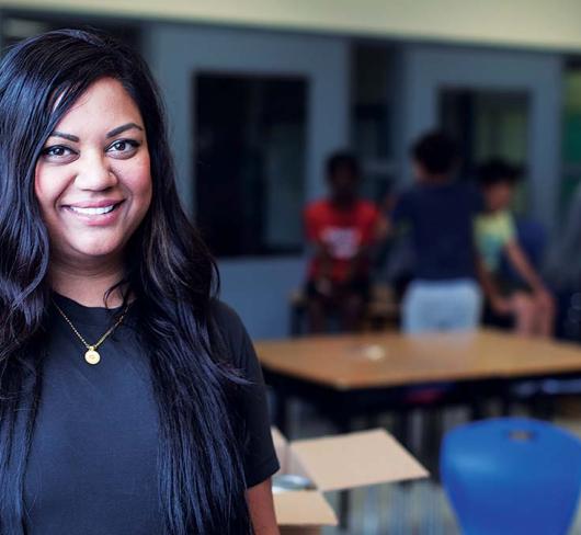 Neema Patel posing in classroom