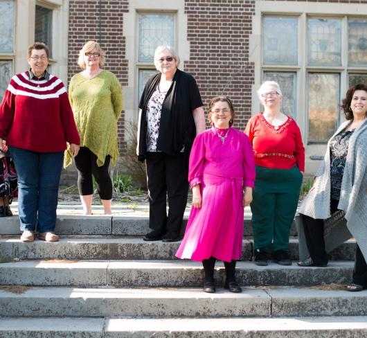 volunteers standing outside of Women’s Literacy Program in Durham