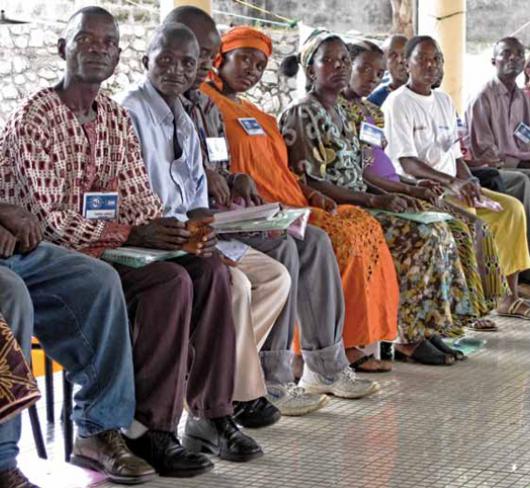 ugandan teachers sitting in line
