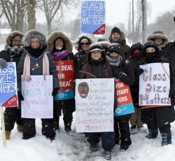 Teachers standing outside in the snow during strike